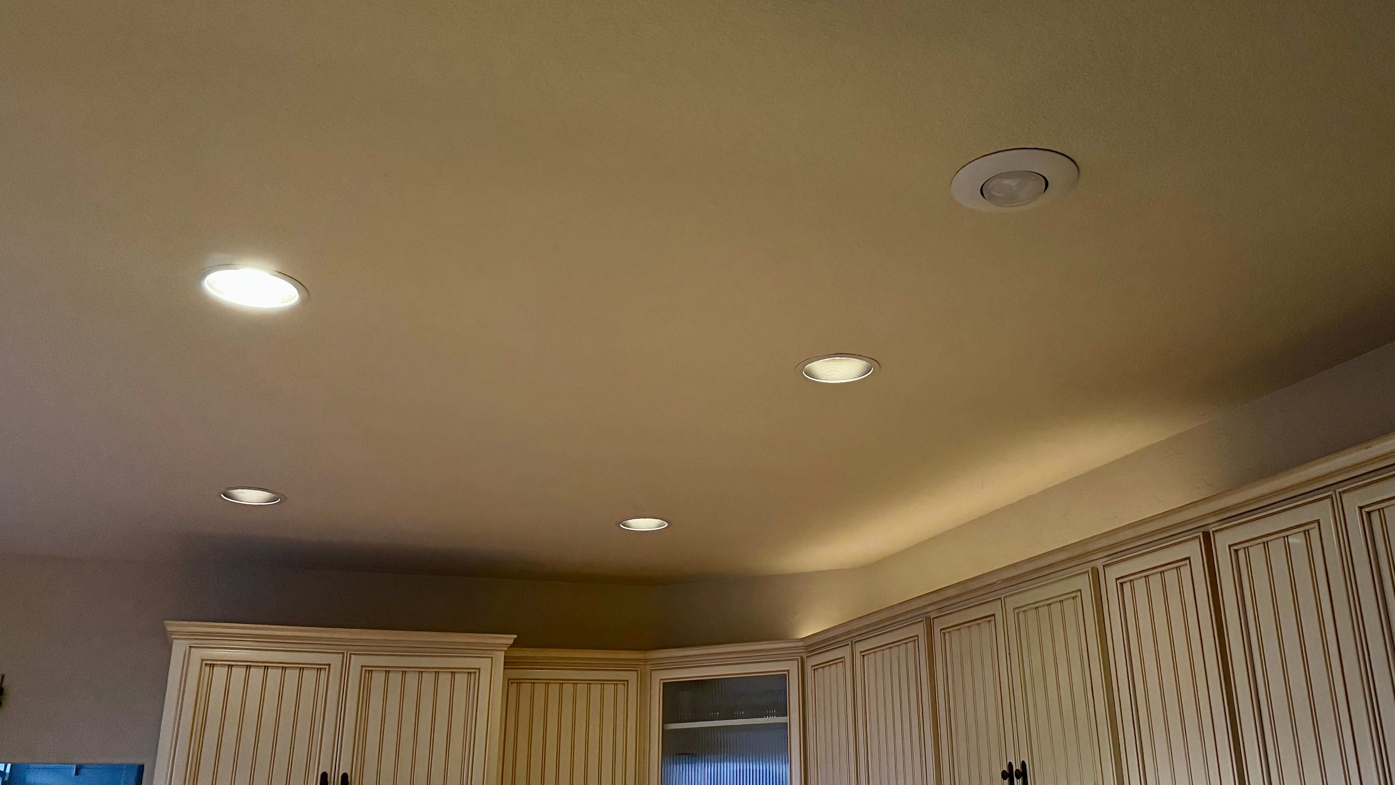 Smart kitchen lights at different brightness levels.