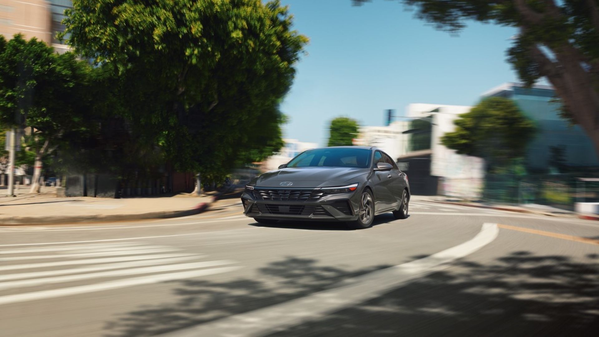 Front 3/4 action shot of a 2025 Hyundai Elantra Hybrid