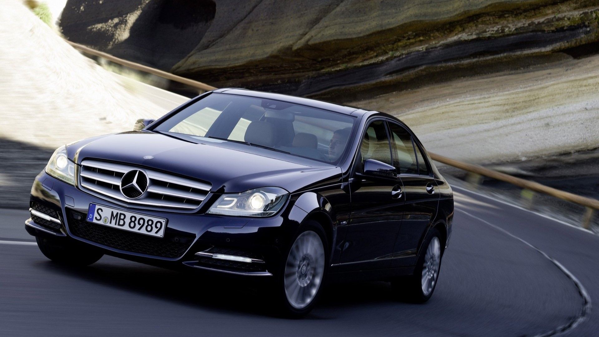 Front 3/4 action shot of a 2012 Mercedes-Benz C-Class