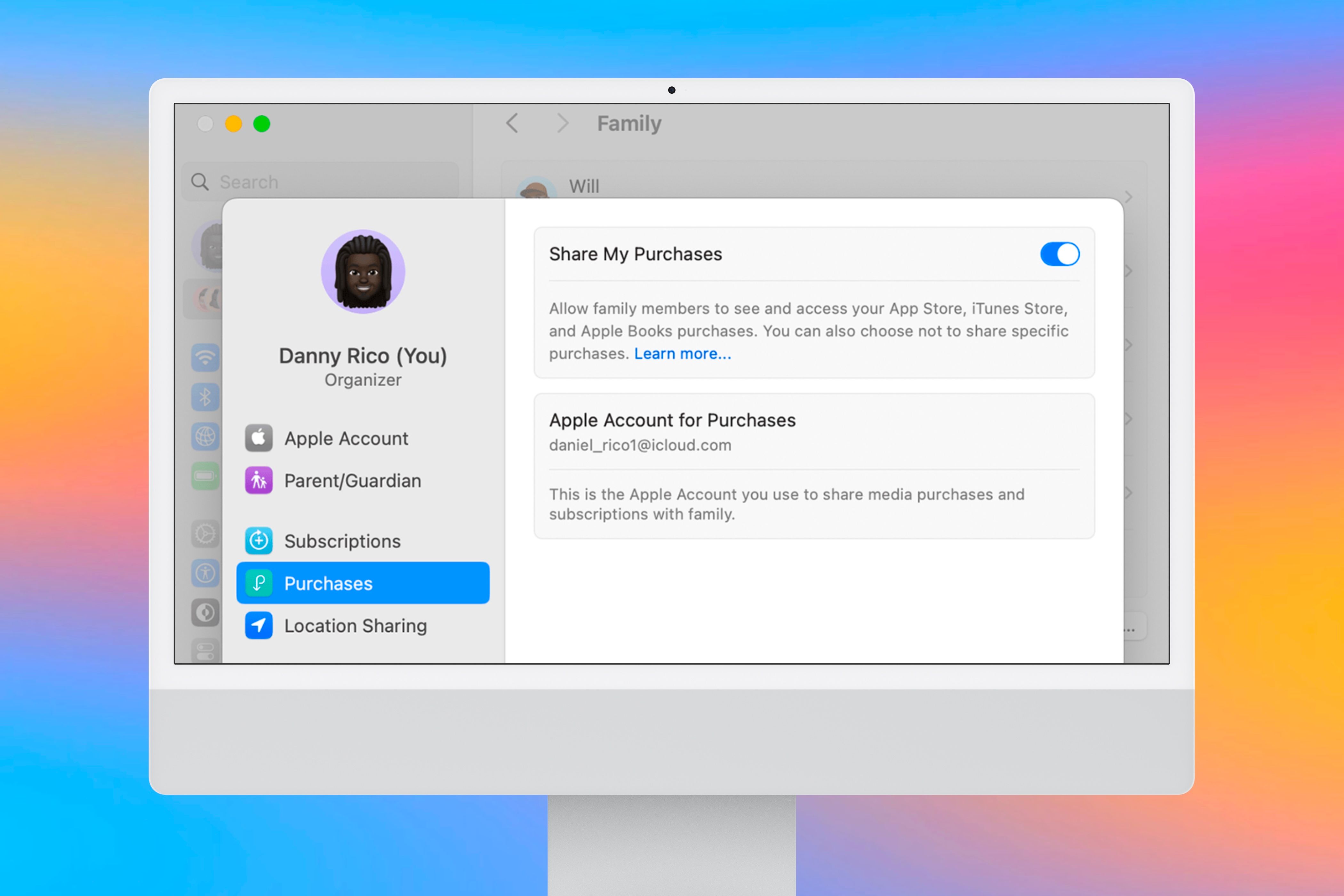 Enabling shared purchases between family members on an iMac in front of a colorful background.