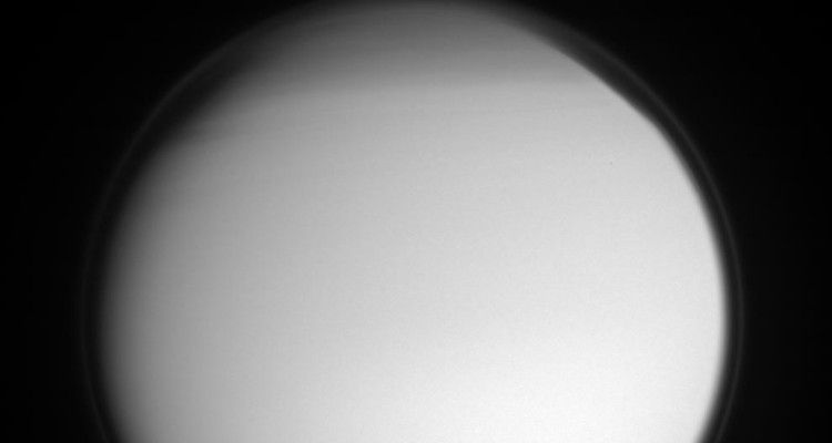 A blurred Titan, due to its hazy atmosphere.