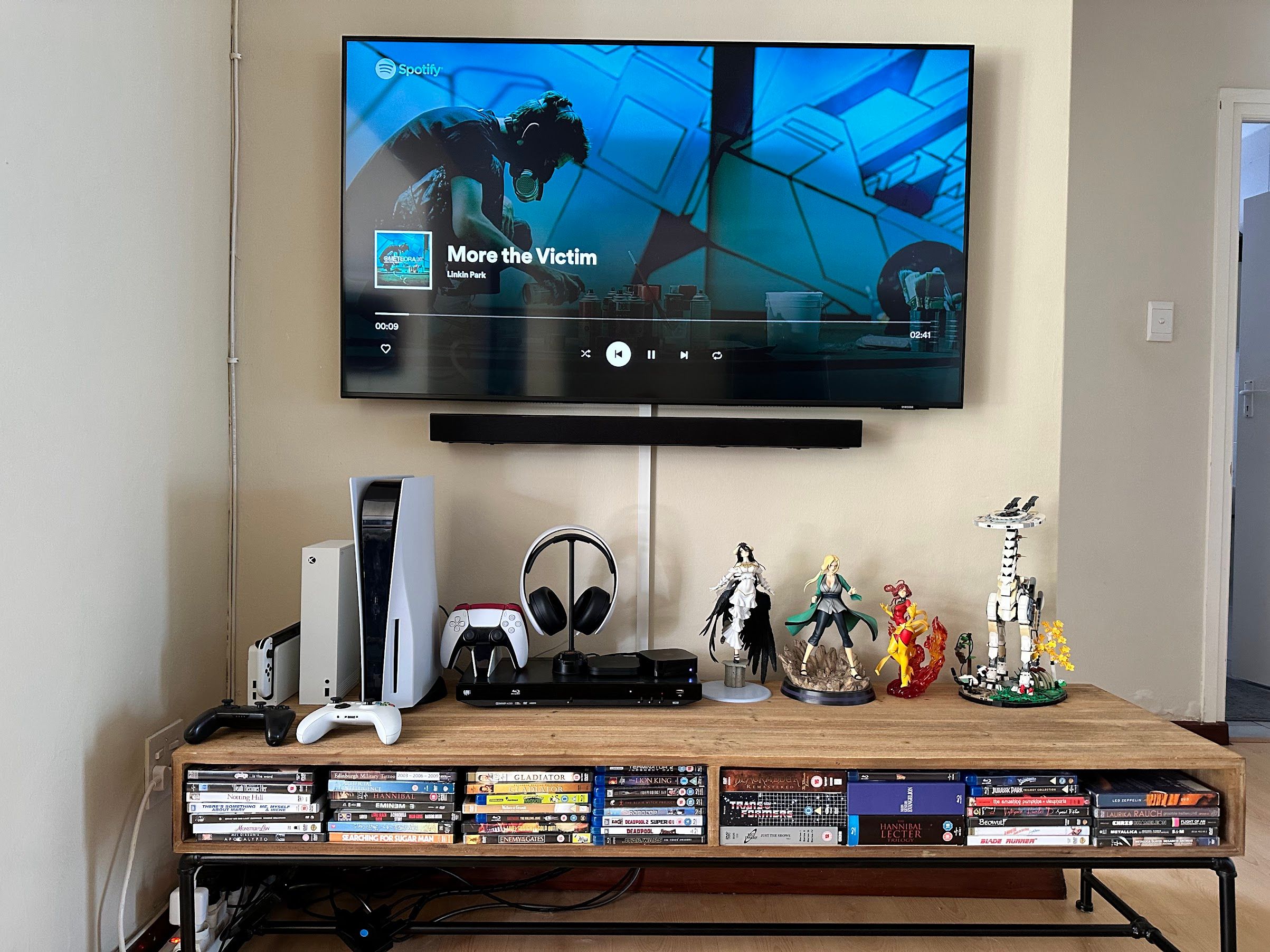 TV stand with DVDs and Blu-rays.