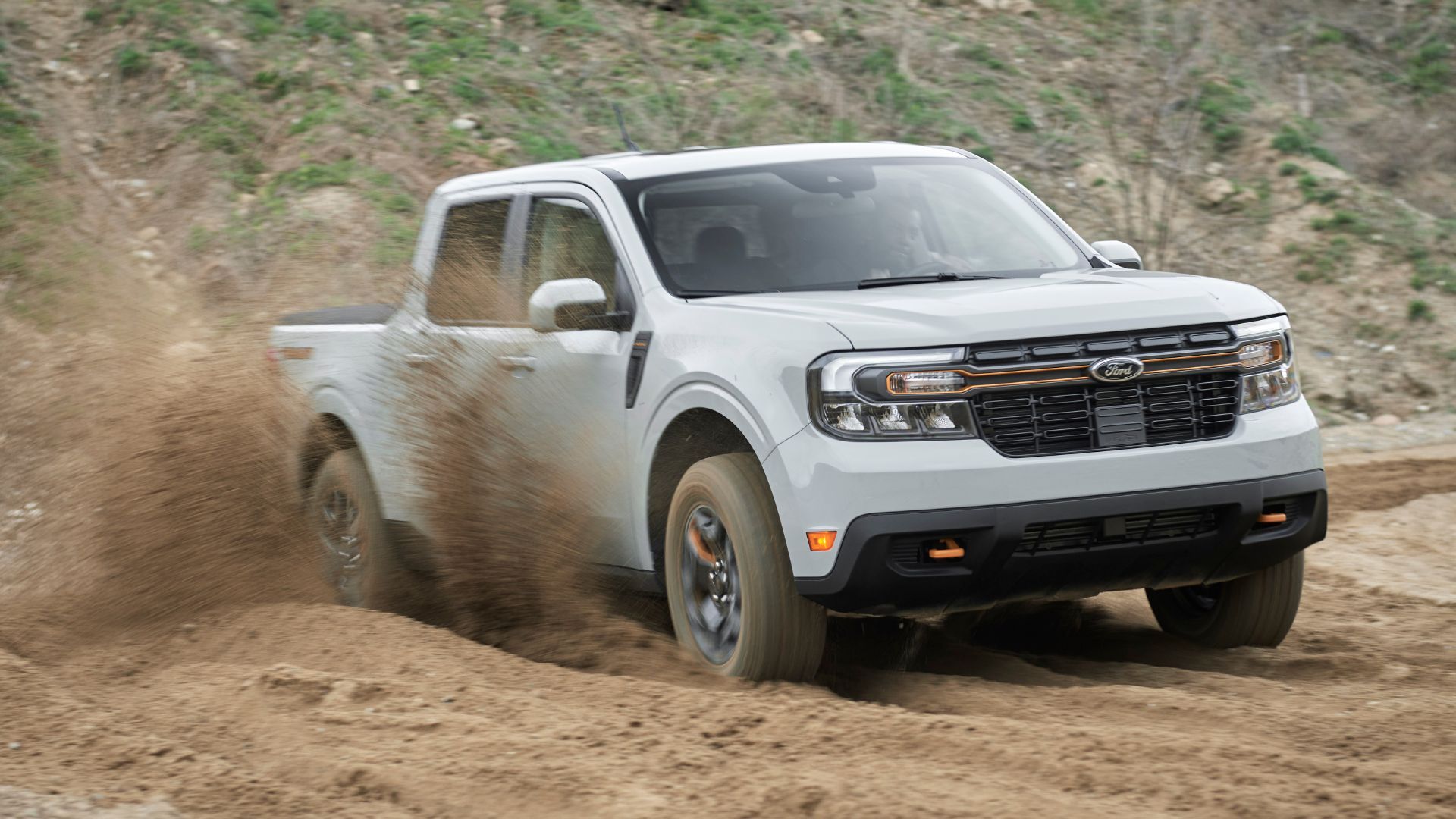 Front thre-quarter view of a gray 2023 Ford Maverick off-roading.