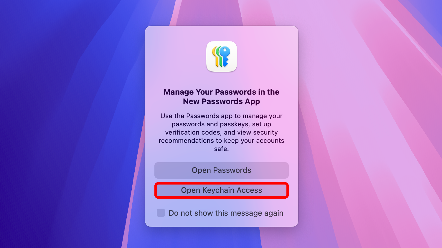 macOS desktop showing a prompt asking whether to open the Passwords app or Keychain Access.