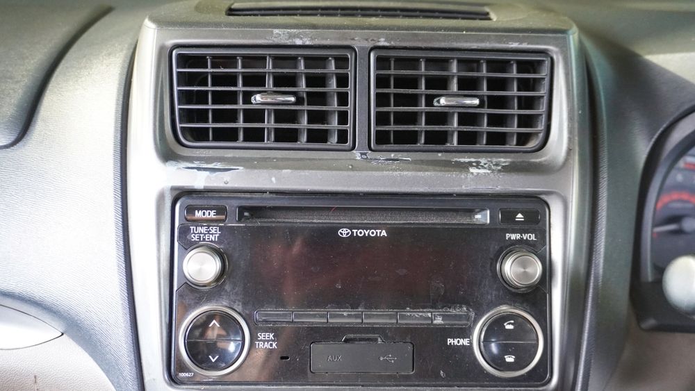 Close up of old head unit of a car.