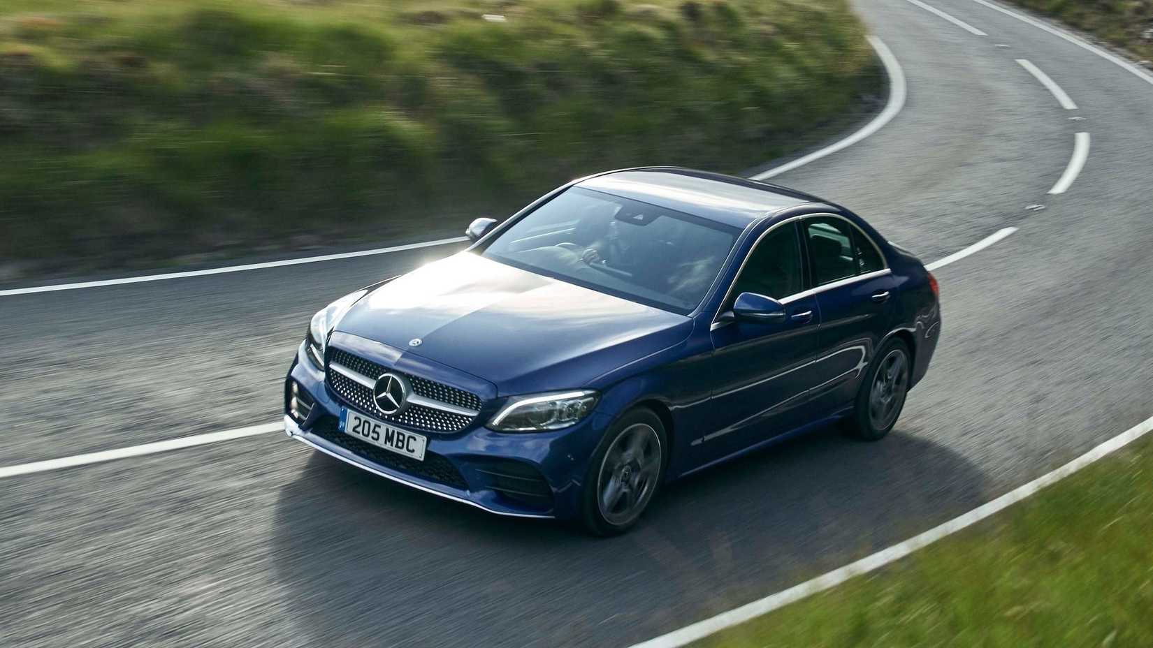 Front 3/4 action shot of a 2019 Mercedes-Benz C-Class