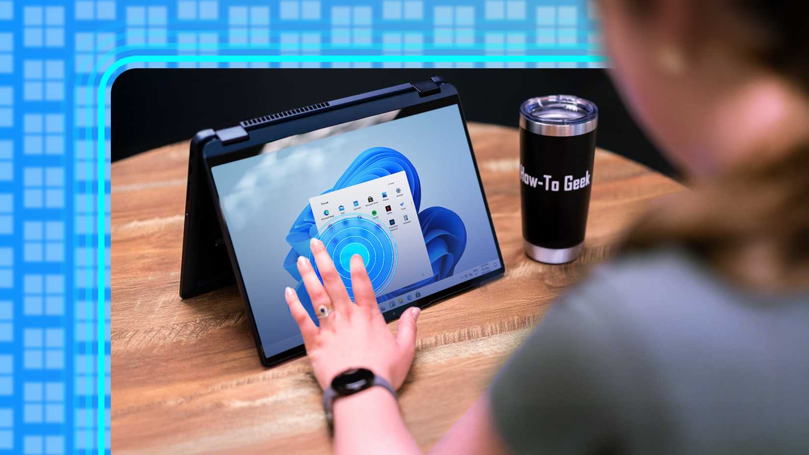 Person using the touch screen on a windows 11 laptop.