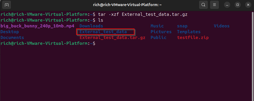 Terminal showing a folder created after extracting a .tar.gz file.