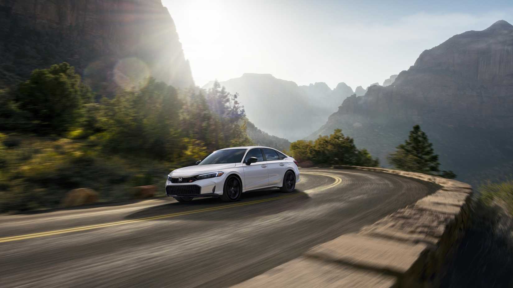 Front 3/4 action shot of a 2025 Honda Civic Si