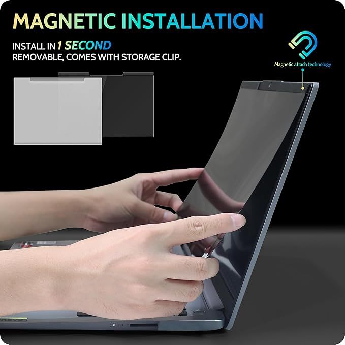 Man applying a privacy screen filter on a laptop screen.