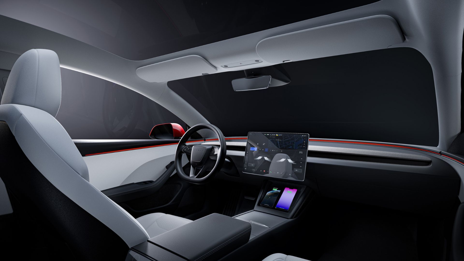 Shot of the interior of the Tesla Model 3 showing the white seats, steering wheel and infotainment screen.