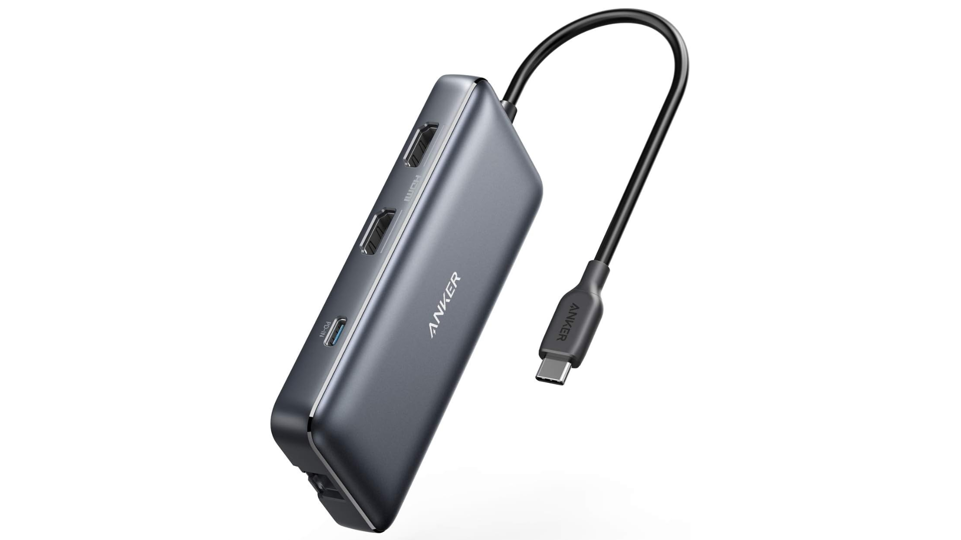 Imagen del concentrador Anker USB-C con múltiples puertos sobre un fondo blanco liso. 