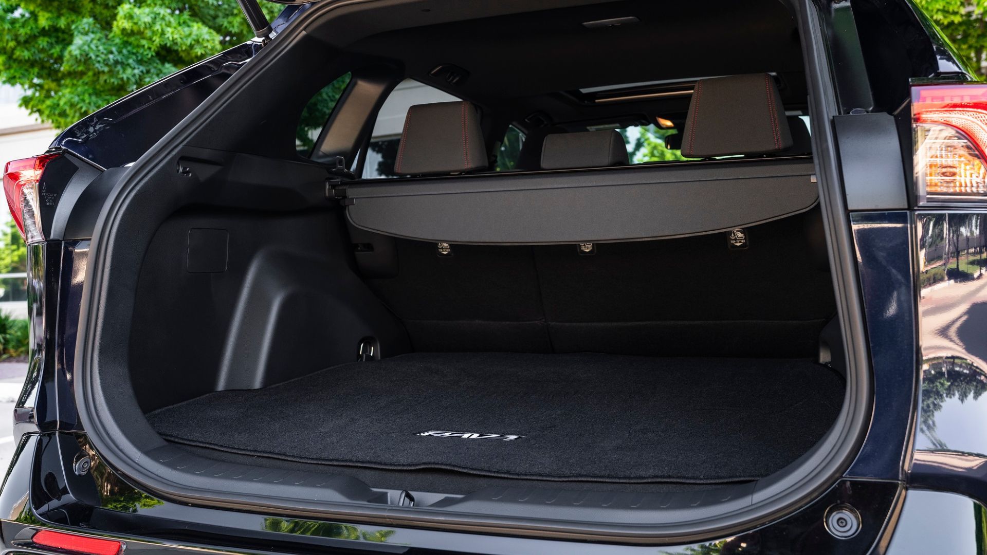 Close-up shot inside the trunk of a 2025 Toyota RAV4 PHEV XSE.