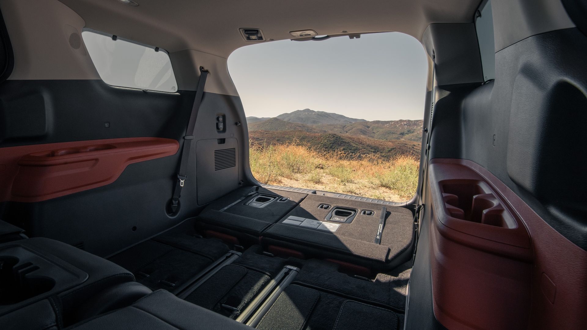 Interior shot of a 2025 Kia Carnival with its rear seats folded away