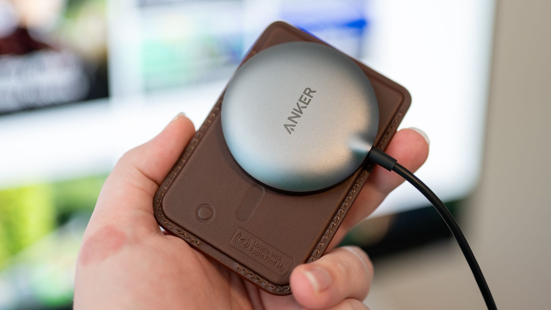 Qi2 charger attached to the Nomad Leather Mag Wallet.