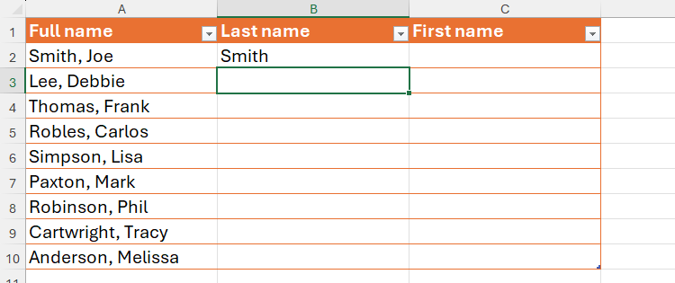 An Excel table with 'Smith' typed into the first cell in the Last Name column.