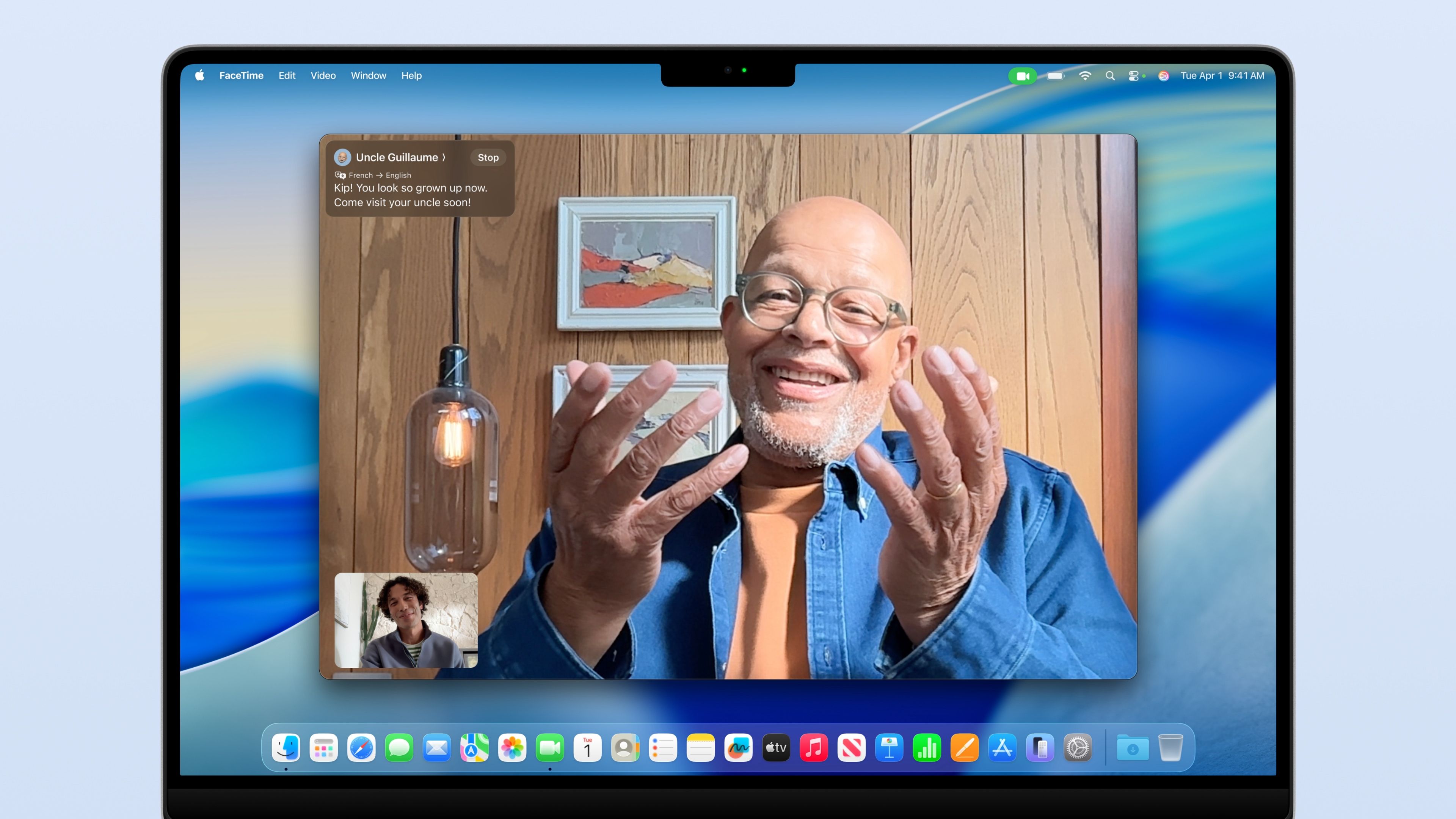 Uncle on a FaceTime Mac video call with his nephew, with live translation displayed as onscreen caption.