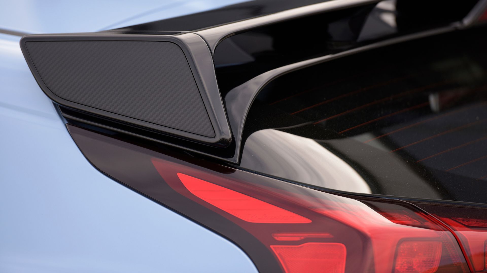 Close-up shot of the rear spoiler on the roof of a blue 2022 Hyundai Veloster N.