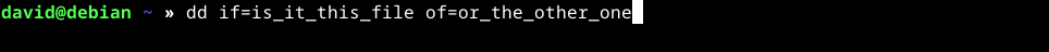 running the Linux dd command with the files "was_it_this_file" and "or_the_other_one" as the source and destination files.