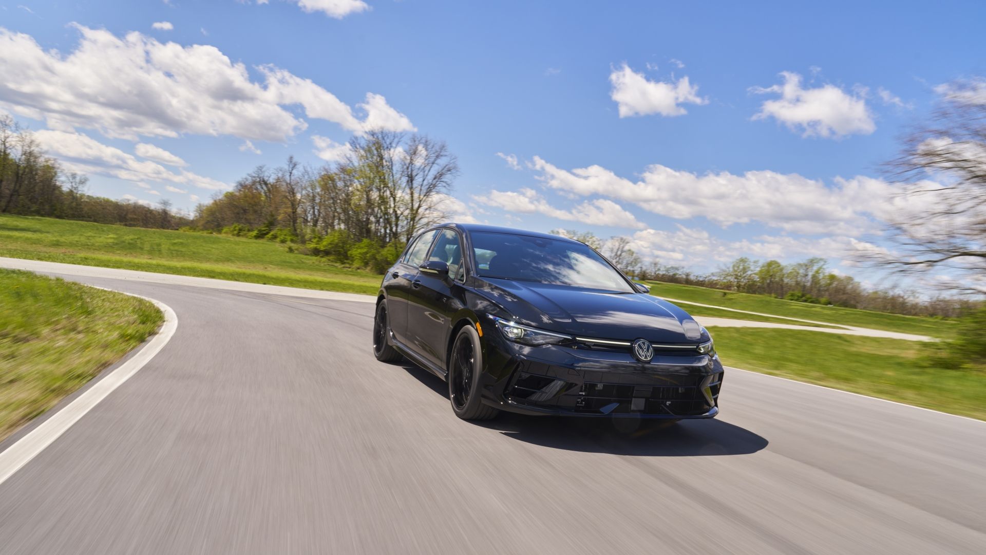Front 3/4 action shot of a 2025 Volkswagen Golf R