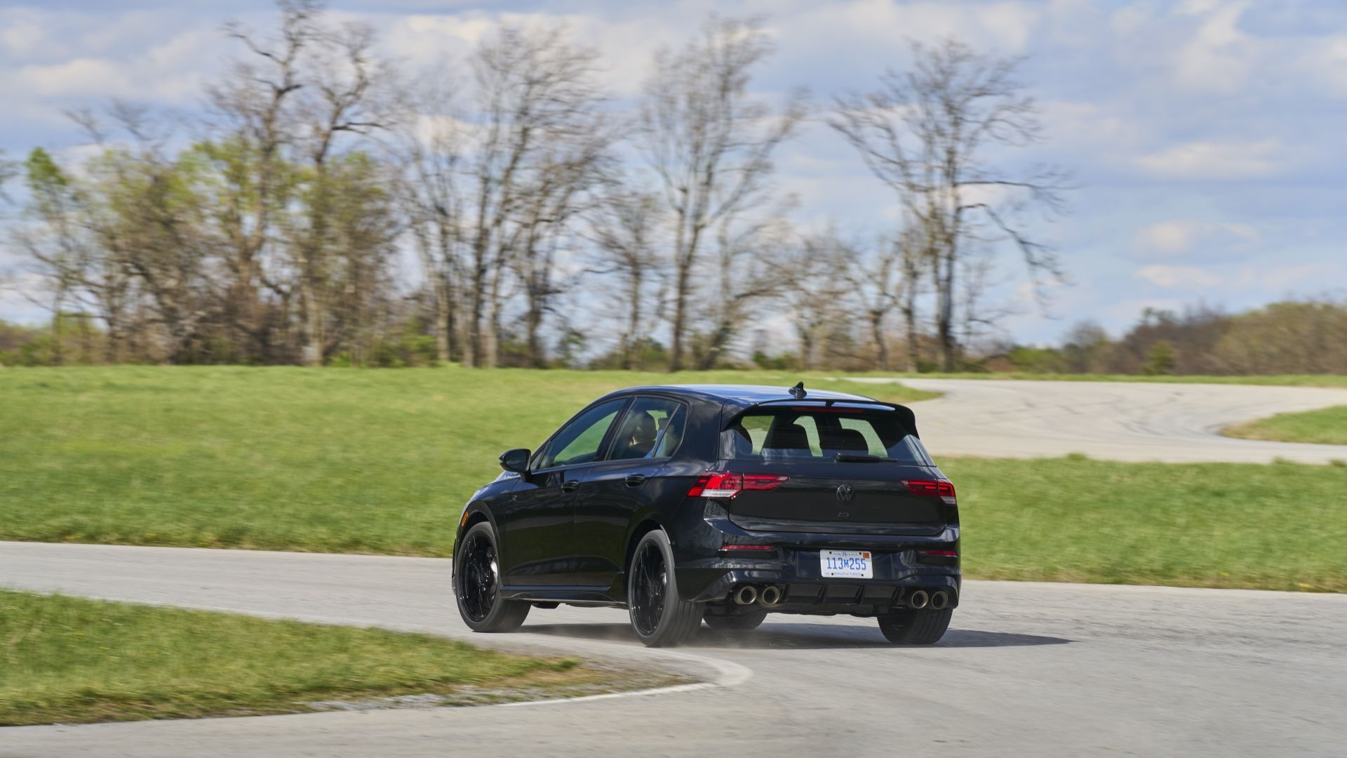 Rear 3/4 action shot of a 2025 Volkswagen Golf R