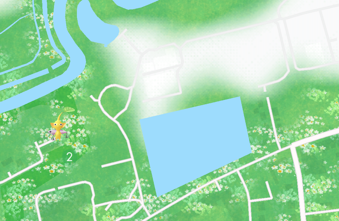 An example map from Pikmin Bloom showing abstract features including white roads, a large blue block, and green areas with flowers planted on them.