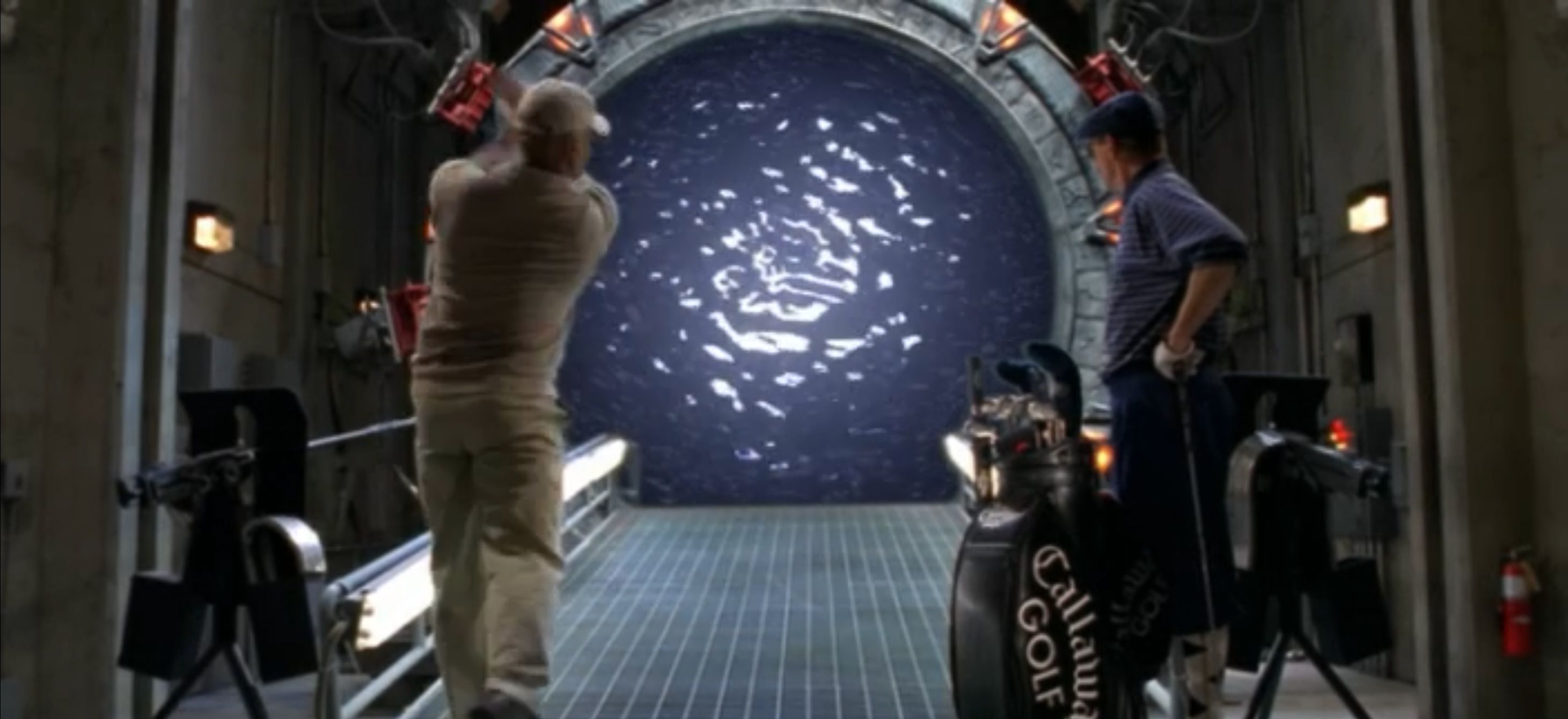 SG-1 crew members playing golf through the stargate.