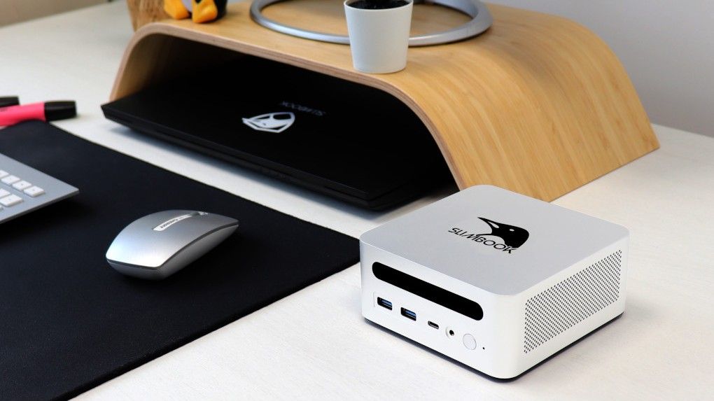 Slimbook One mini PC on a desk.