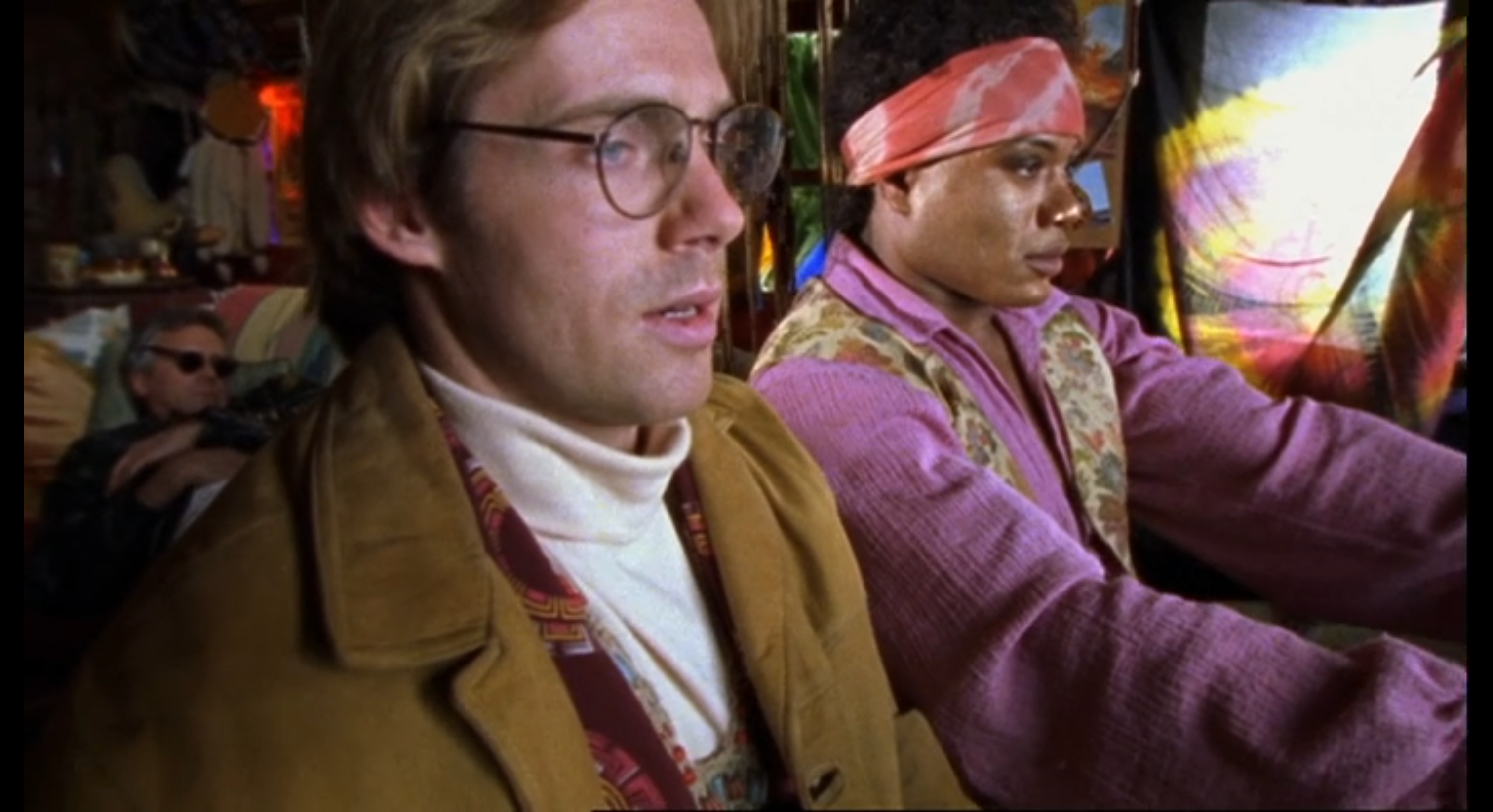 Teal'c and Jackson from SG-1 in 60's clothing.