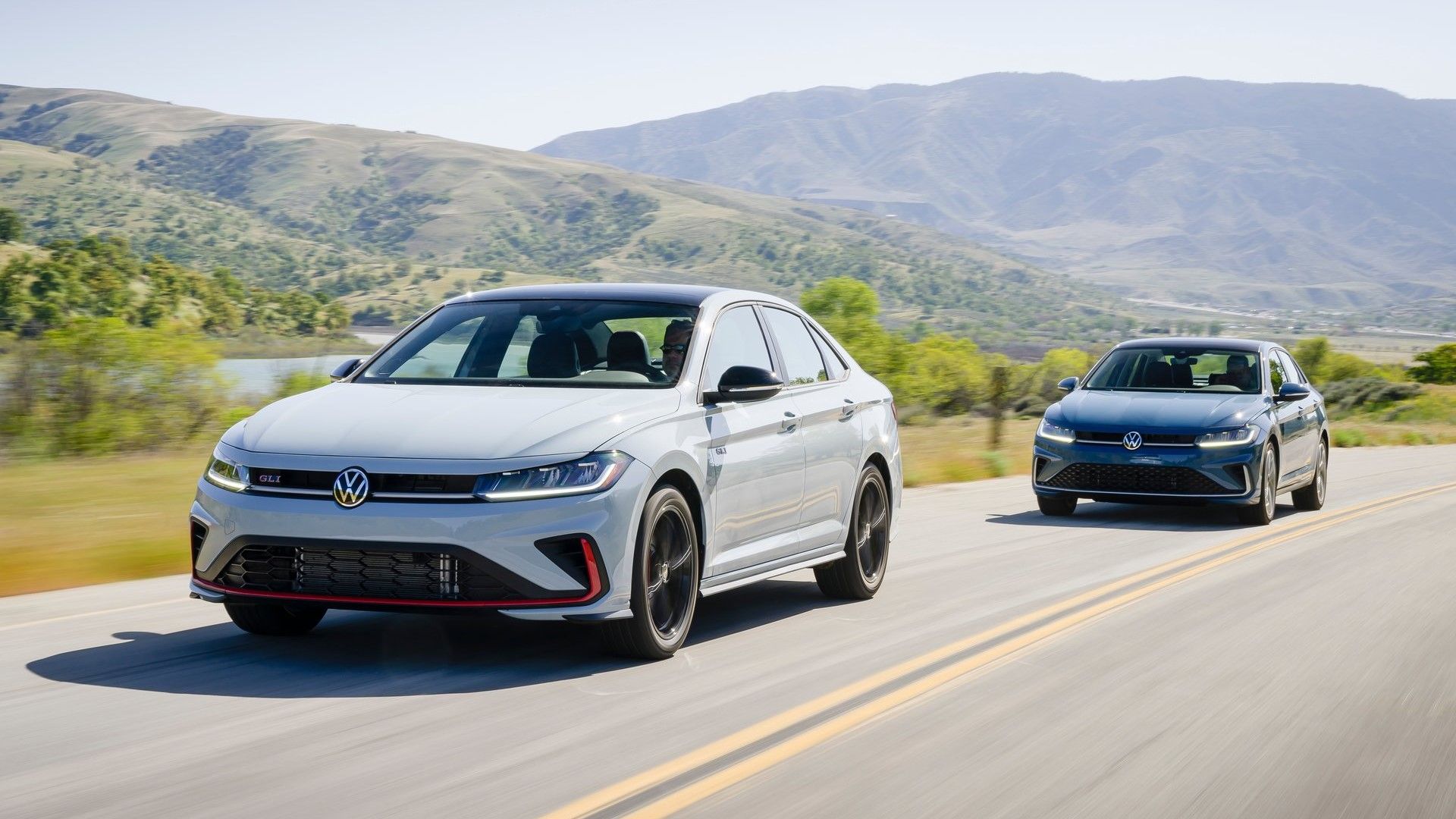 Shot of a 2025 Volkswagen Jetta GLI and Volkswagen Jetta driving
