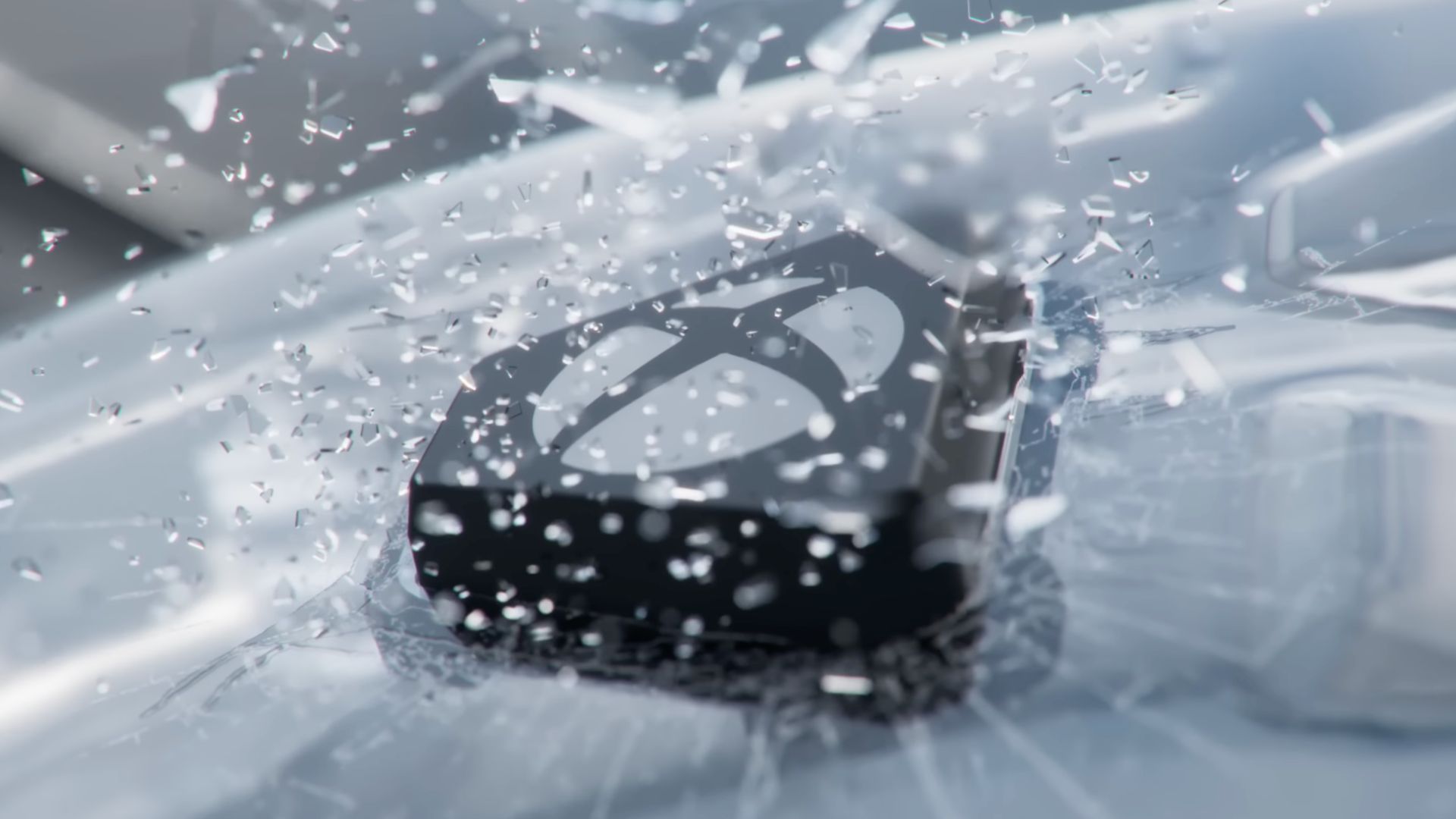 Xbox button smashing through glass in the ROG Xbox Ally reveal.