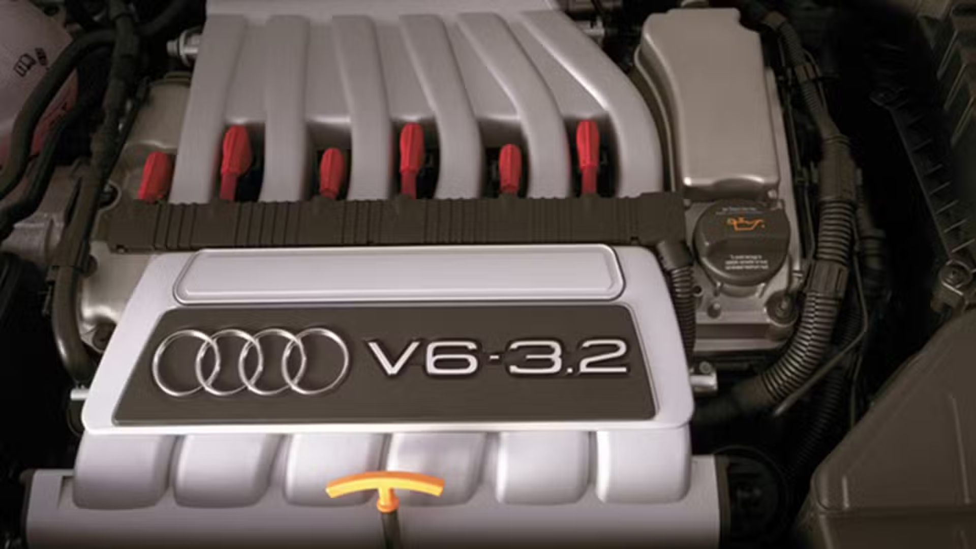Close-up shot under the hood of a 2009 Audi TT Quattro, showing the 3.2 V6 engine.