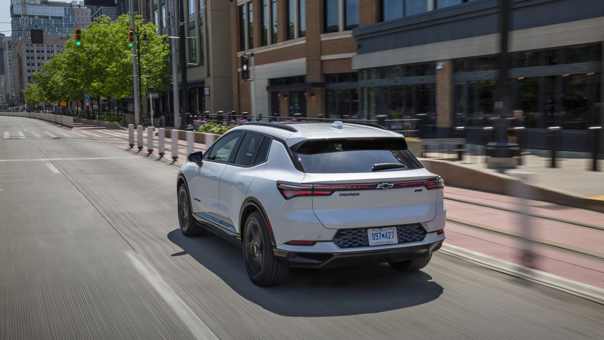 Rear 3/4 action shot of a 2025 Chevrolet Equinox EV