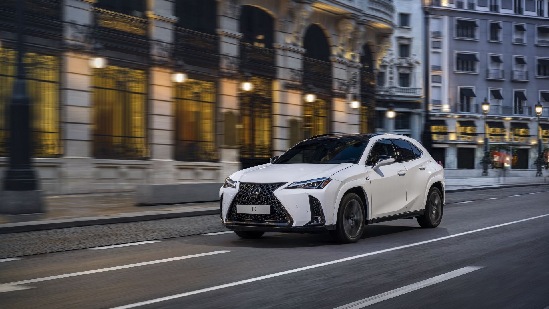Front 3/4 action shot of a 2025 Lexus UX