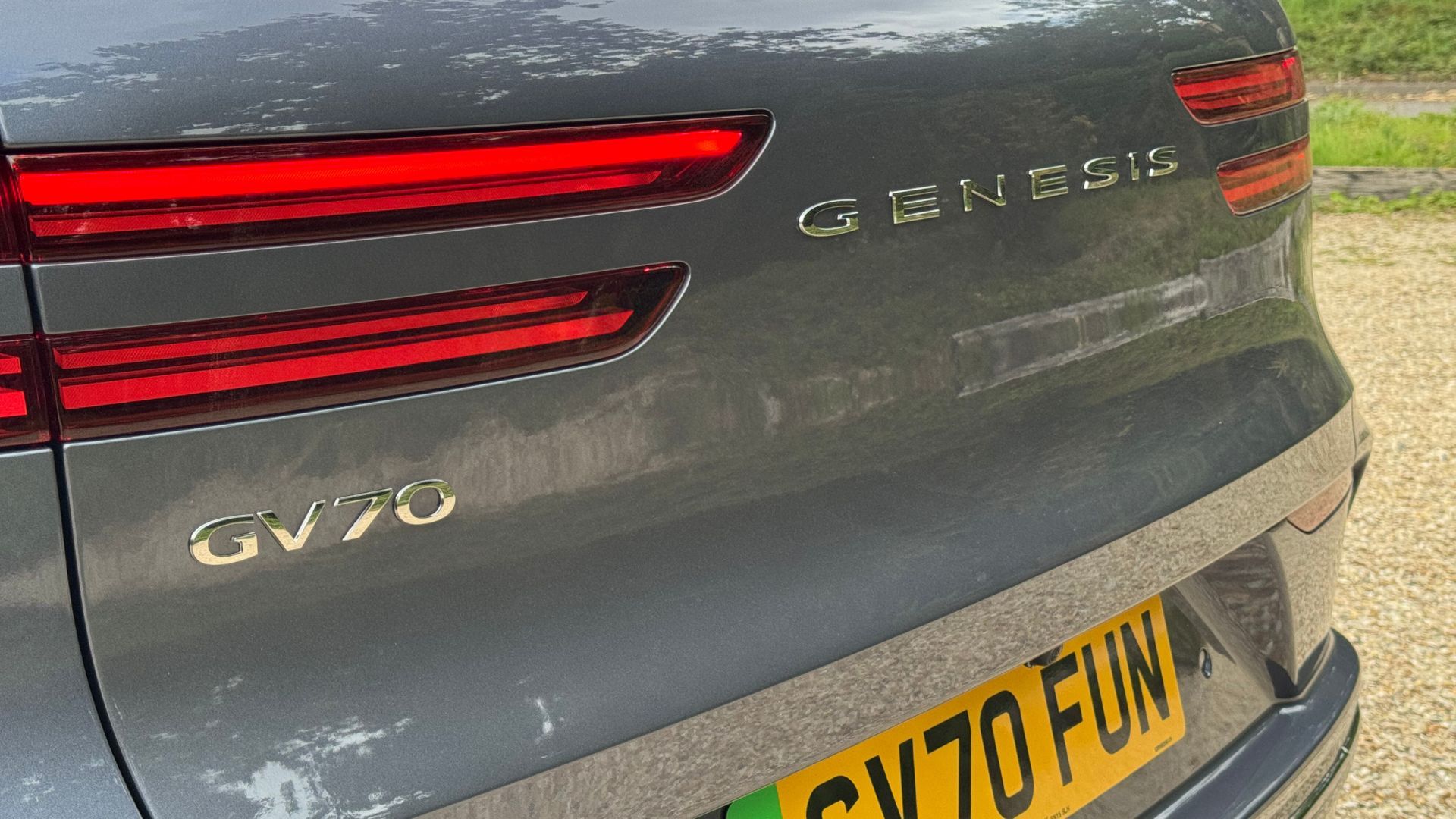 Close-up shot of the tailgate on a gray 2026 Genesis Electrified GV70.