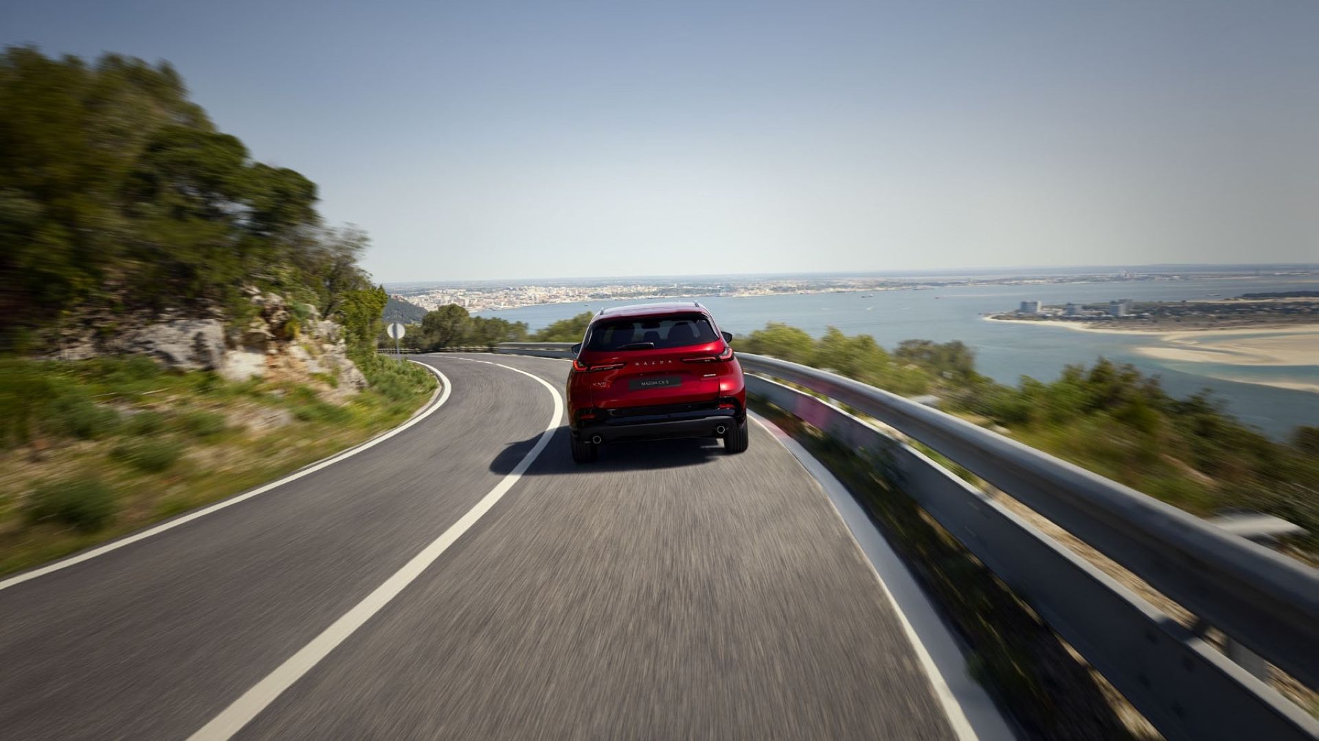 Rear action shot of a 2026 Mazda CX-5 