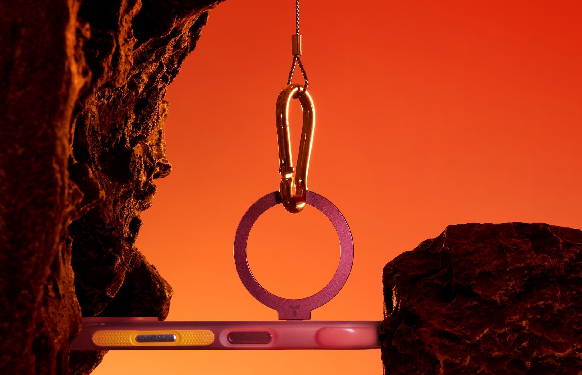 A TORRAS Q3 Air case suspended with a carabiner.