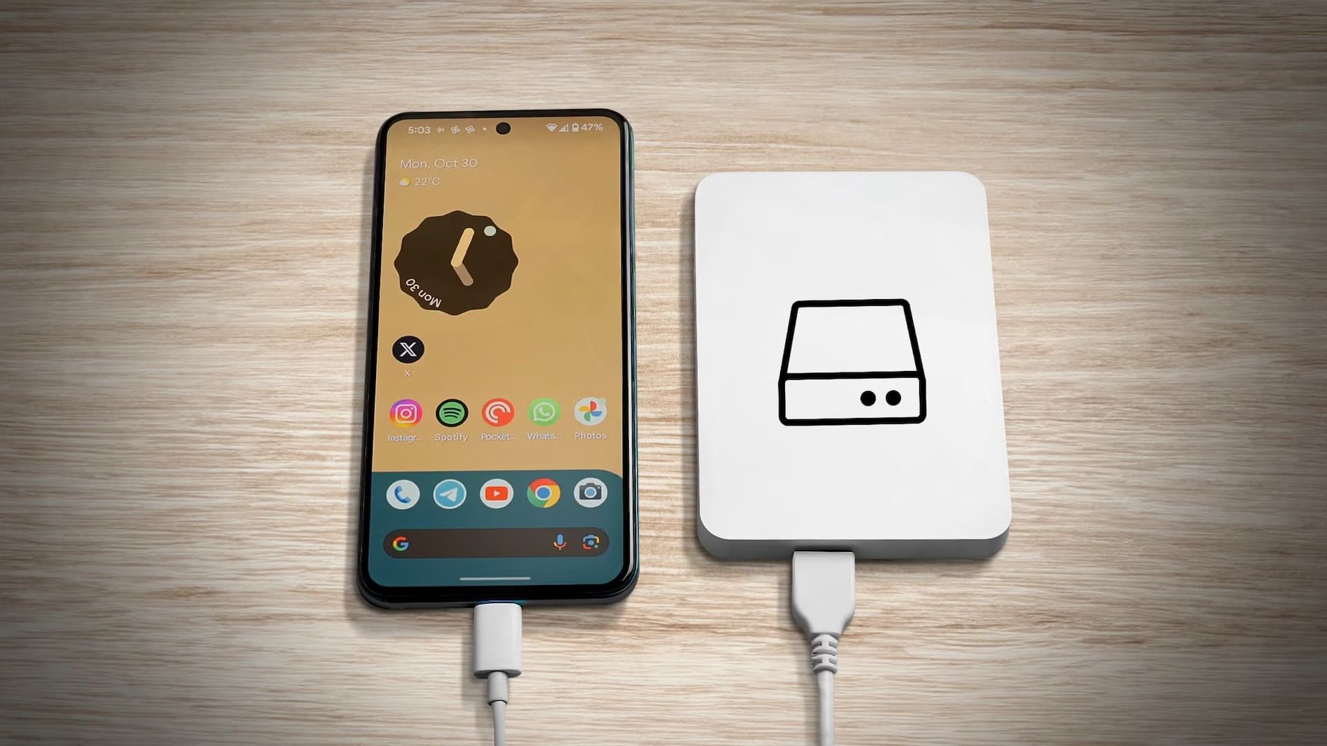 An Android phone on the left with android home screen and a Hard Drive on the right with a hdd logo.