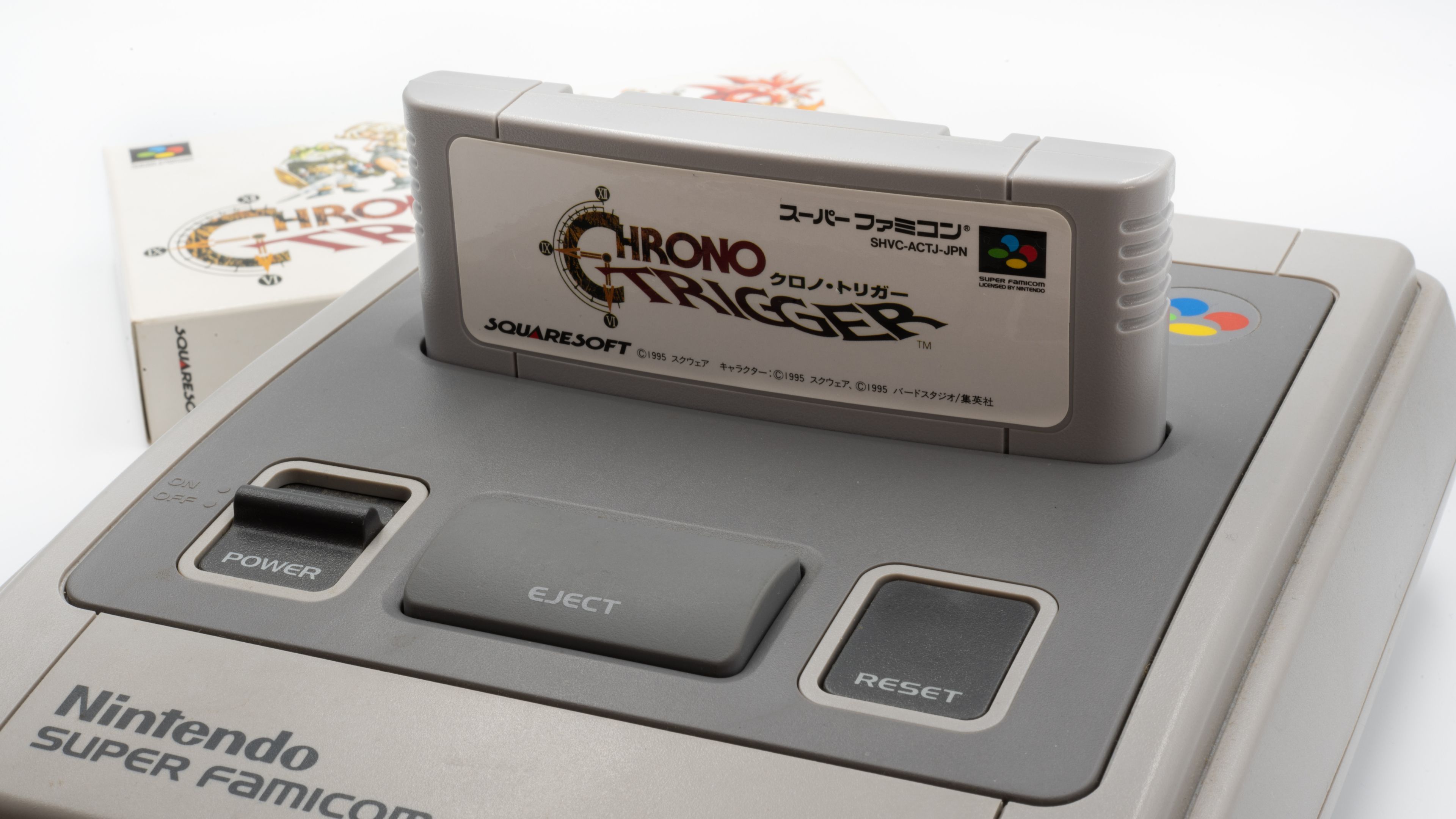 Chrono Trigger in a Super Famicom (SNES) console.