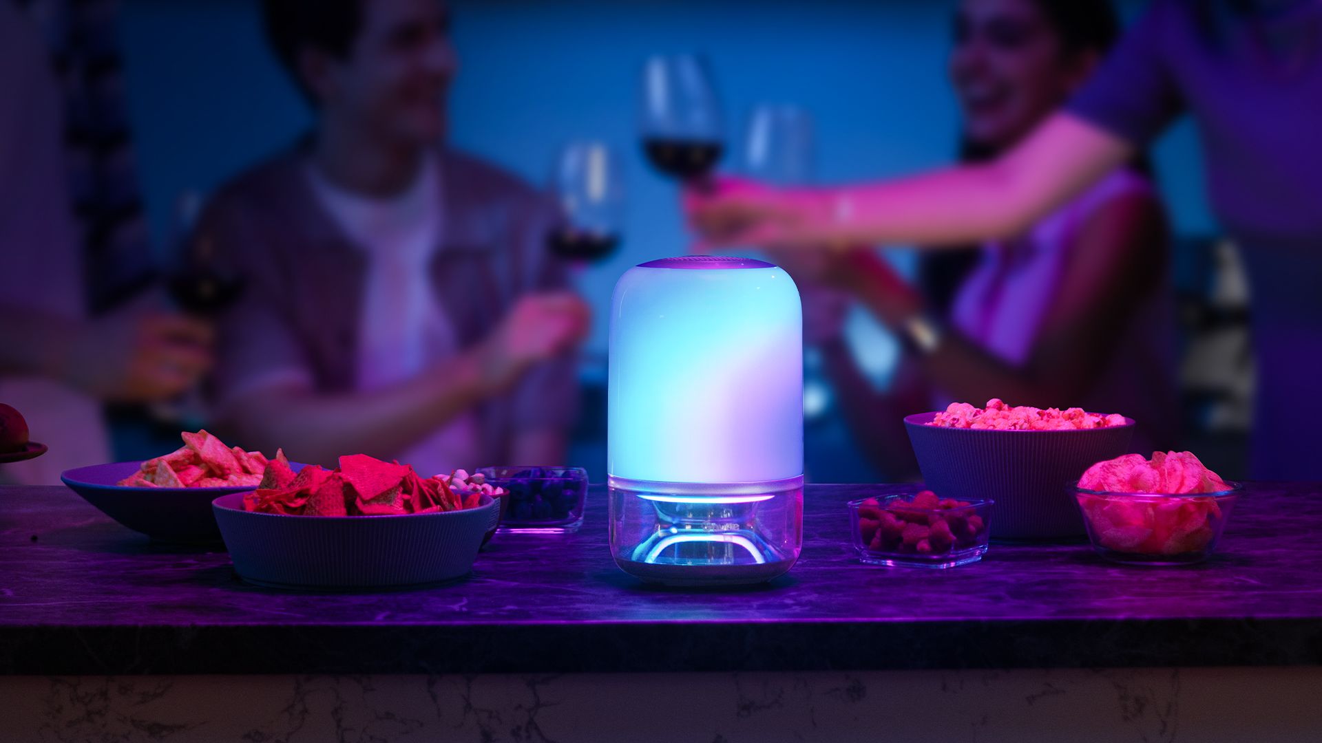 The Govee Table Lamp 2 Pro x Sound by JBL on a table at a gathering.
