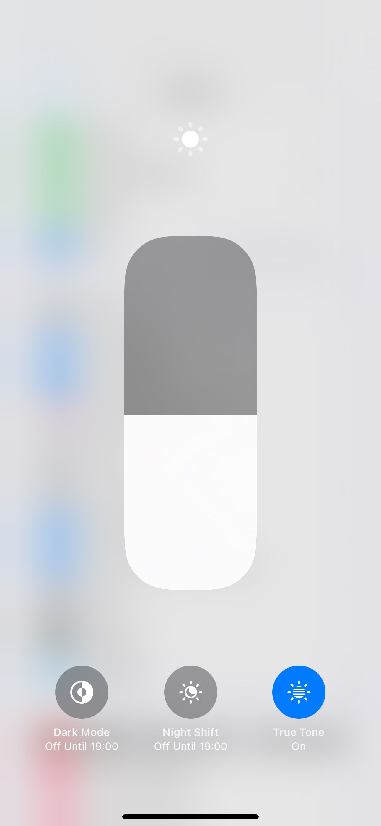 Dark Mode toggle turned off in Control Center on an iPhone.