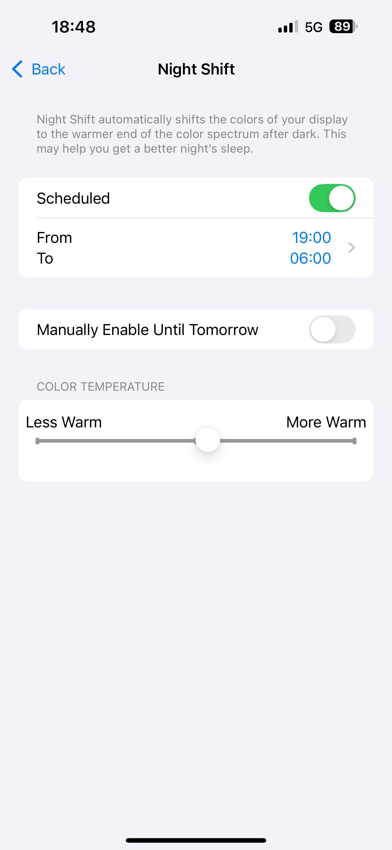 Enabling the Scheduled option for Night Shift in iOS Settings.