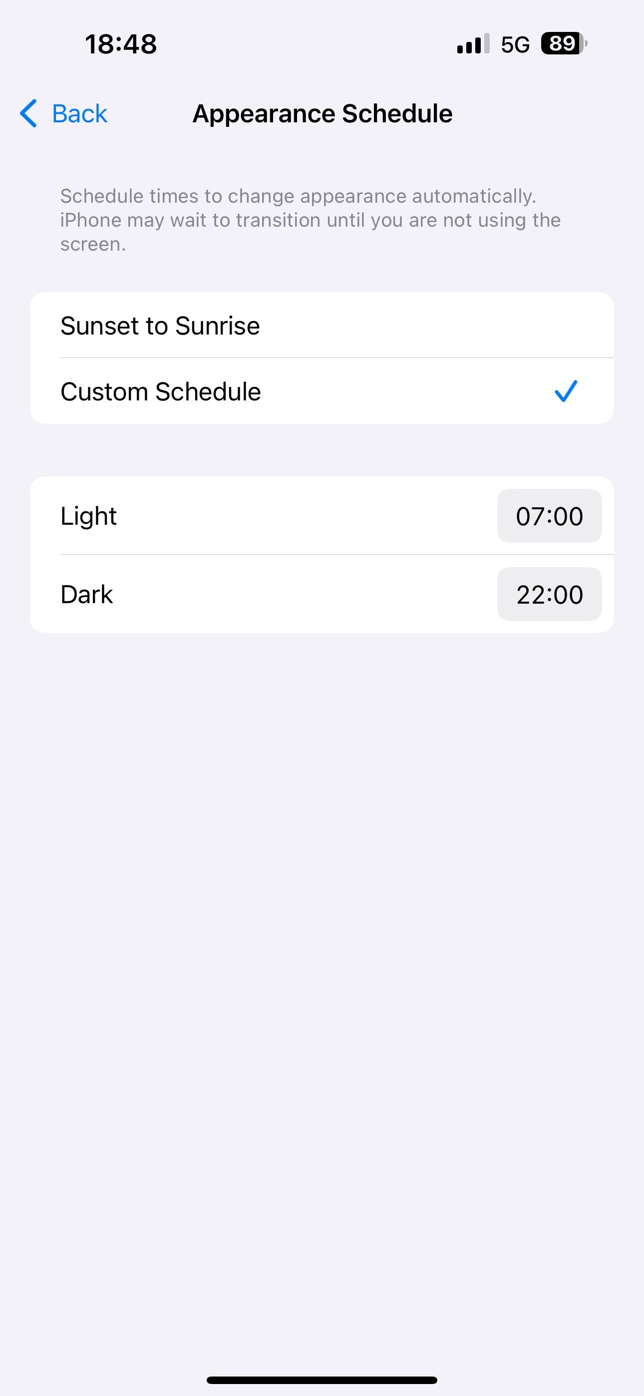 Setting the Automatic option for display appearance to the Custom Schedule option and setting a schedule.