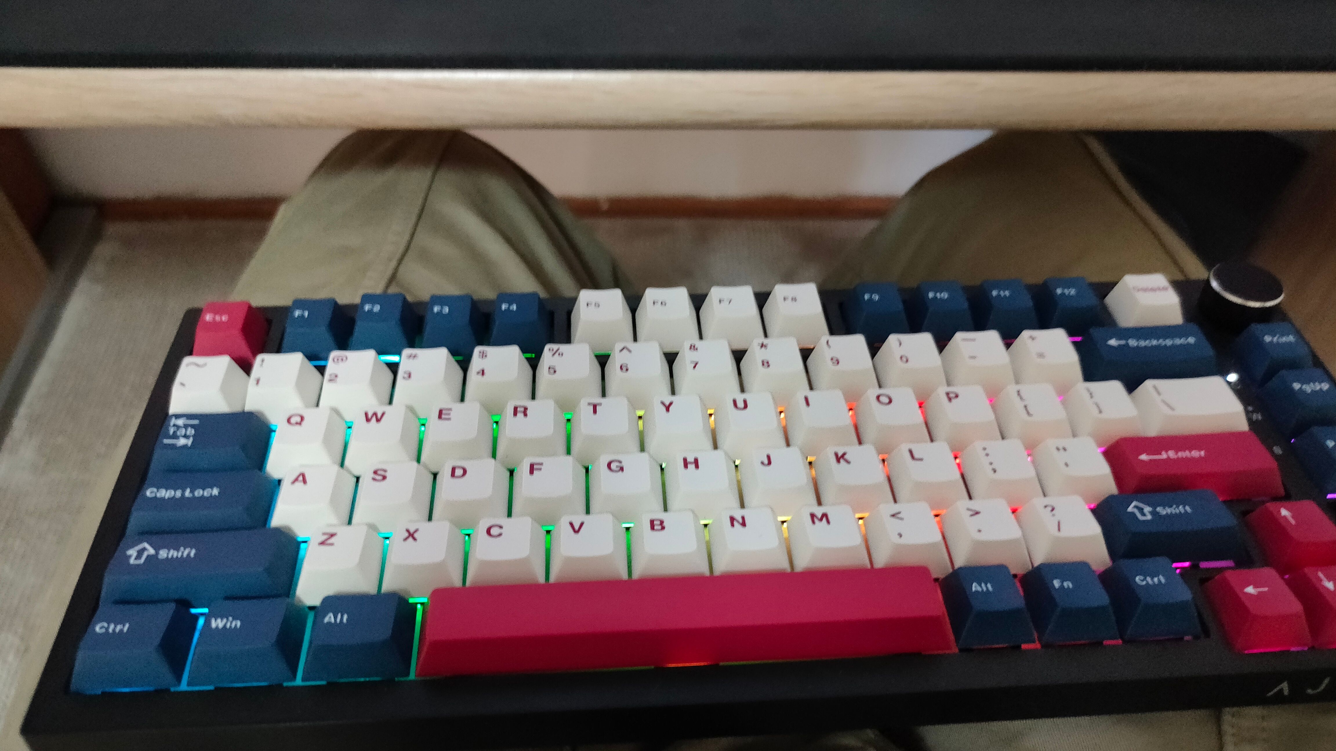 A mechanical keyboard in a lap.
