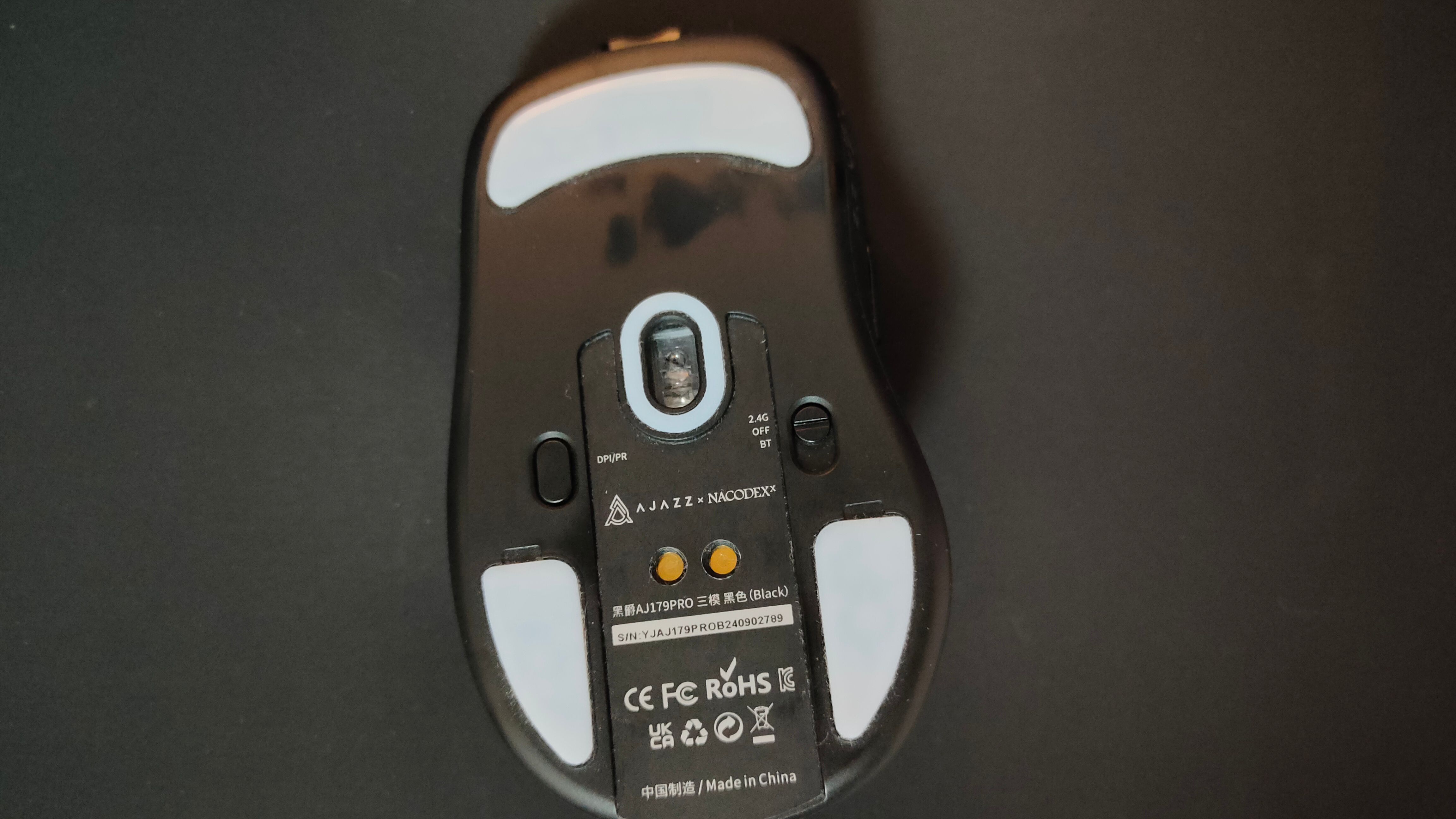 The mouse skates and underside of the Ajazz AJ179 Pro gaming mouse.