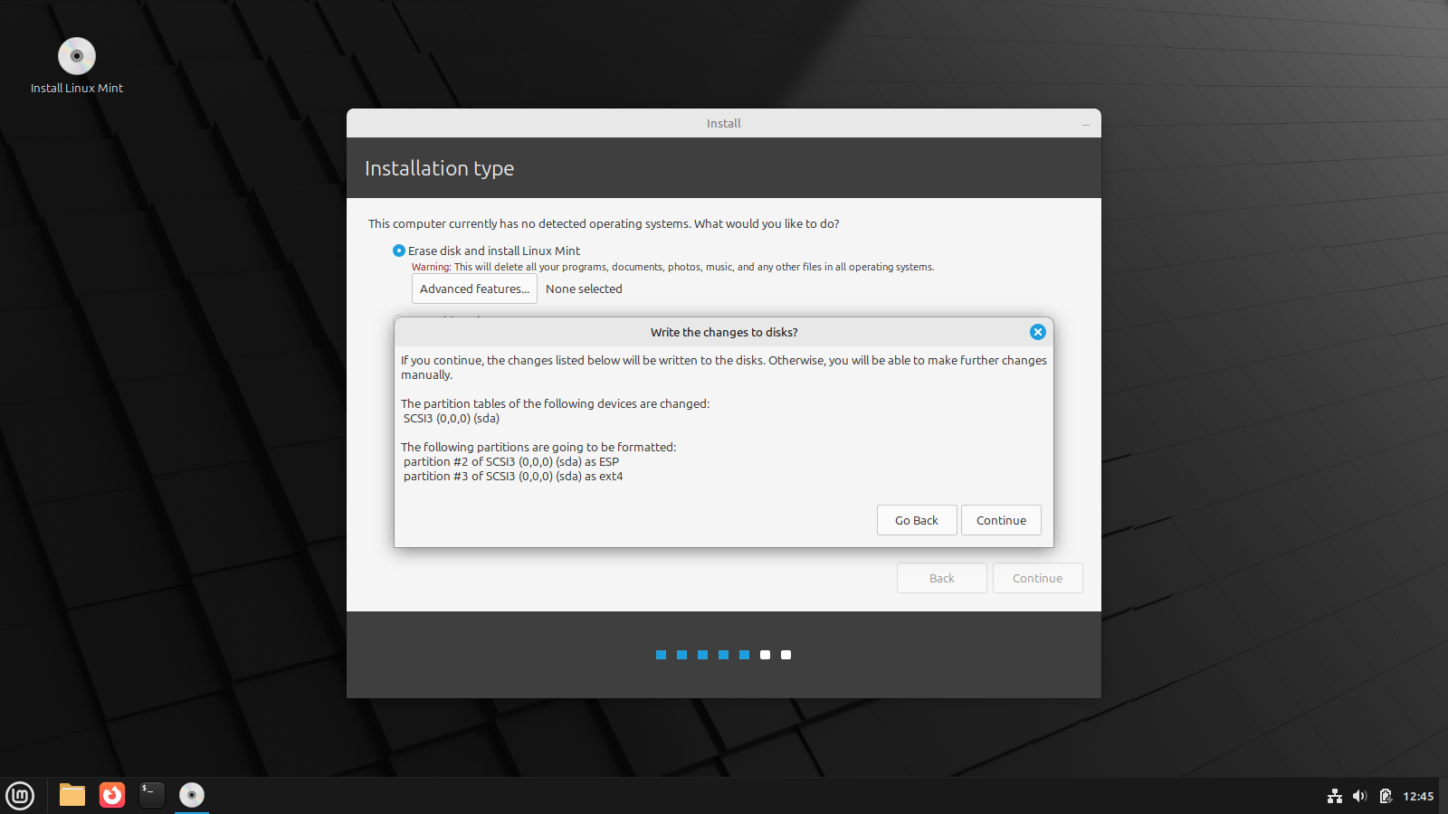 Linux Mint installer showing confirmation for hard drive partitions.