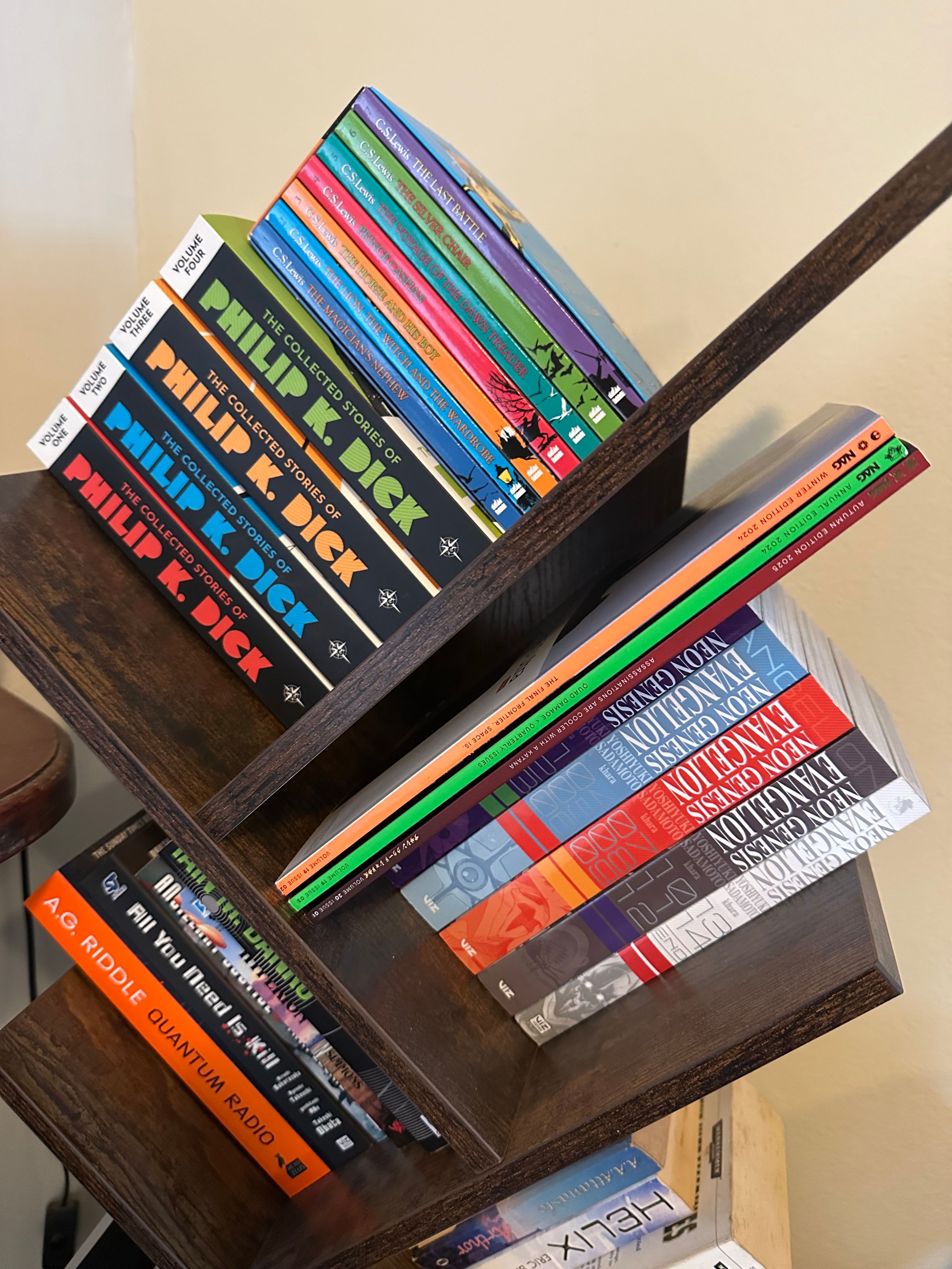 NAG magazines on a bookshelf among other books.