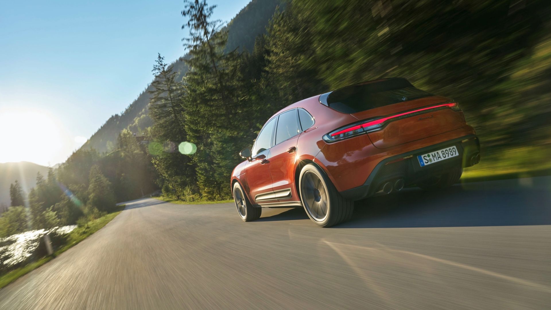 Rear 3/4 action shot of a 2025 Porsche Macan