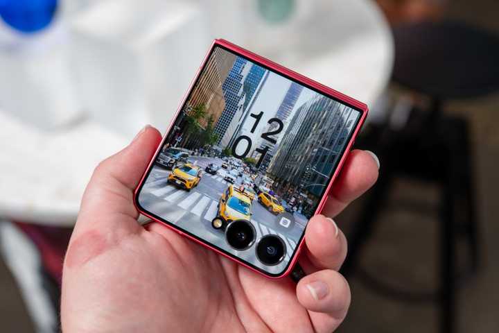 person holding the samsung galaxy z flip 7 showing the cover display 54642055371 o-1