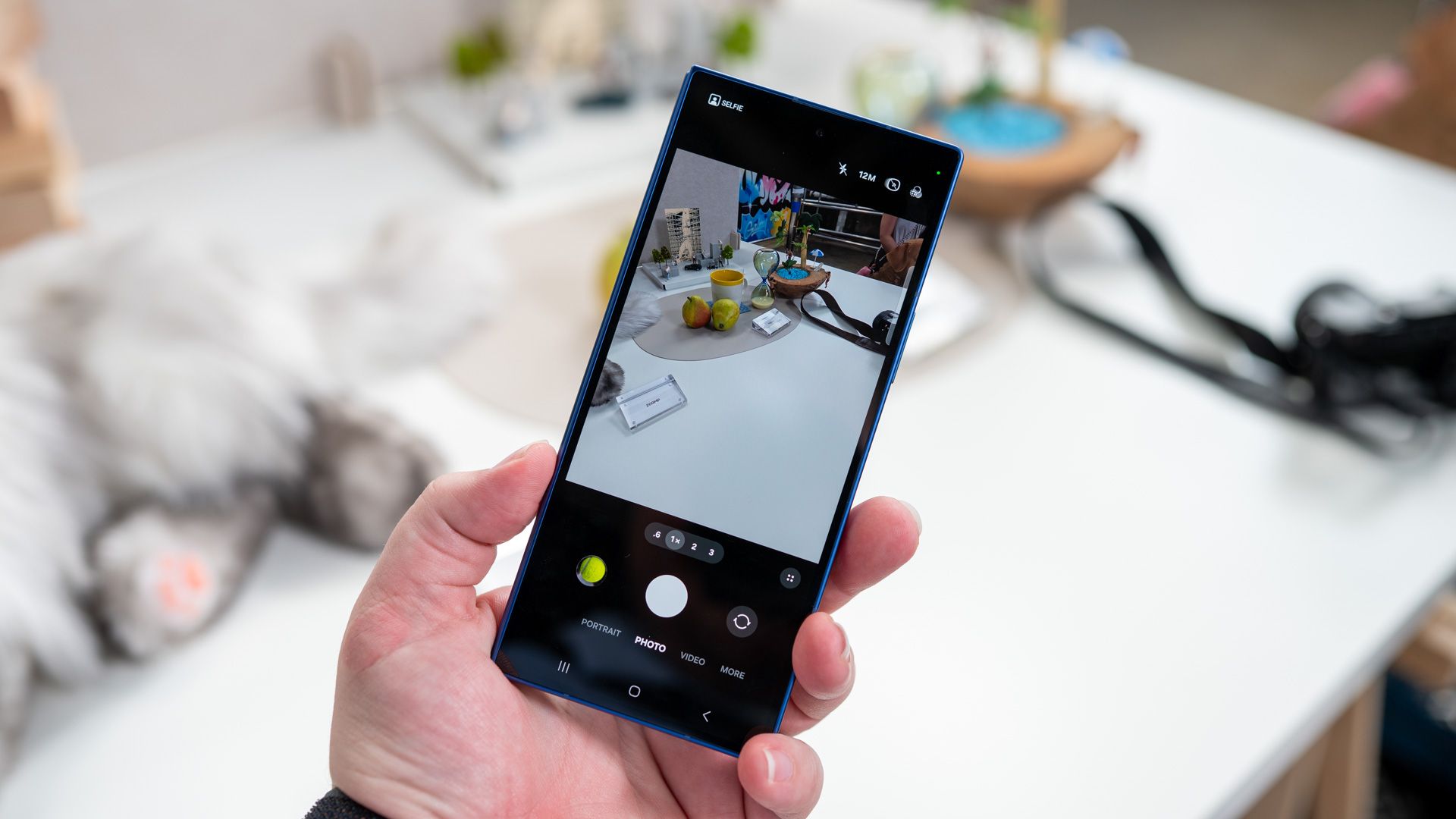 person holding the samsung galaxy z fold 7 folded showing the camera app 54642055656 o